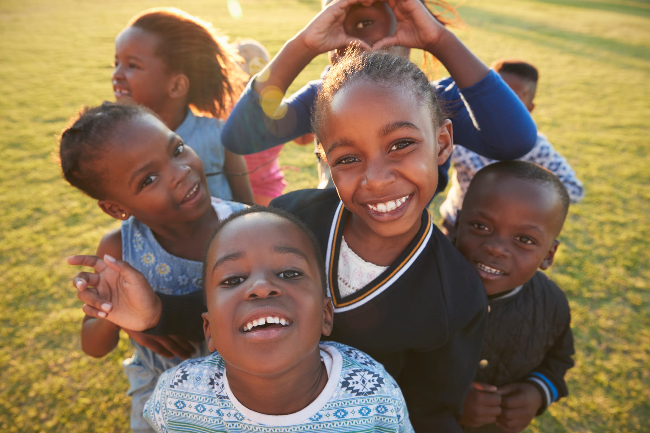 Children smiling and playing outdoors